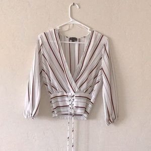 White blouse with different colored stripes with corset bottom